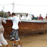 Fishermen moving their boat to safer place after alerts issued by the authorities regarding the effects of cyclone “Biparjoy