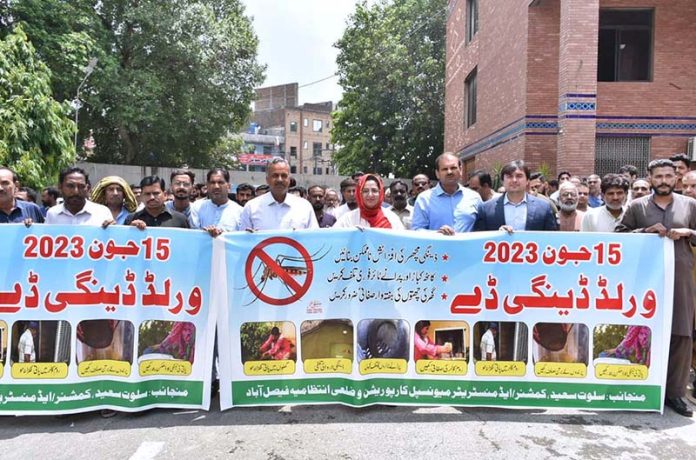 Commissioner Silwat Saeed along with Deputy Commissioner Ali Anan Qamar participating in an awareness walk in connection with World Anti Dengue Day at Municipal Corporation