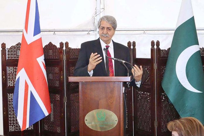 Federal Minister for Commerce Syed Naveed Qamar addressing British Pakistanis in London to invest in Pakistan to get benefit from profitable business opportunities