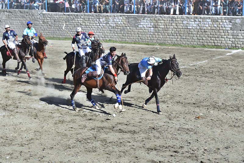 Players from NLI and GB Scouts teams in action during the final match of Jashn-e-Baharan Freestyle Polo Tournament at Aga Khan Shahi Polo Ground