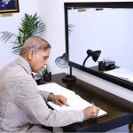 Prime Minister Muhammad Shehbaz Sharif penning down his views in the Yadgar-r-Shuhada in Police Lines Headquarters