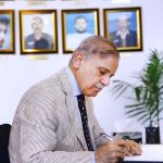 Prime Minister Muhammad Shehbaz Sharif penning down his views in the Yadgar-r-Shuhada in Police Lines Headquarters