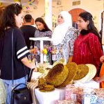 Visitors taking keen interest in handmade crafts during an exhibition