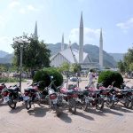 A large number of motorcycles parked in the premises of Shah Faisal Masjid as people visit on weekend