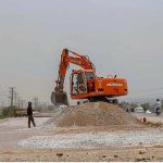 Heavy machinery being used to expand lanes for smooth traffic on Islamabad Expressway