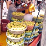 A vendor selling summer drink lemonade at his roadside setup in the Federal Capital