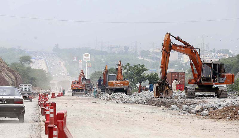 Heavy machinery being used to build new lanes on Islamabad Expressway