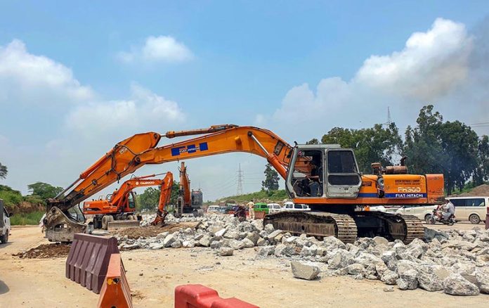 Heavy machinery being used to expand lanes on Islamabad Expressway