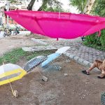 A vendor displaying umbrellas to attract the customers at F-6/1 in Federal Capital