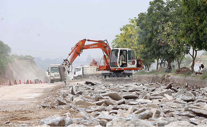 Heavy machinery being used to build new lanes on Islamabad Expressway