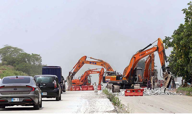 Heavy machinery being used to expand lanes on Islamabad Expressway