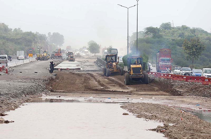 Heavy machinery being used to build new lanes on Islamabad Expressway