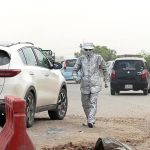 A Silver man standing on the roadside at PWD Islamabad Expressway