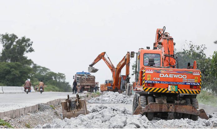 Heavy machinery is being used to expand lanes for smooth traffic on Islamabad Expressway