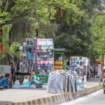 A view of encroachment displaying different kinds of stuff at footpath creating problems for pedestrians at Double Road
