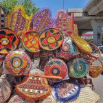 A street vendor displaying different kinds of household stuff to attract customers at Shamsabad