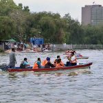 A family enjoying boat ride at Race Course Park as large number of families arrives to spend their holiday