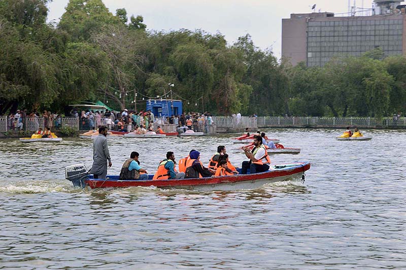 A family enjoying boat ride at Race Course Park as large number of families arrives to spend their holiday