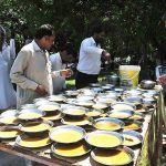Free food being distributed by Islamabad Crescent Lions Club among the deserving people at Poly Clinic