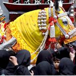 Mourners touch the Zuljinah (Symbolic Horse) during the 10th Muharram procession to mark Ashoura. Ashoura is the commemoration marking the Shahadat (death) of Hussein(AS), the grandson of the Prophet Muhammad(PBUH), with his family members during the battle of Karbala for the upright of Islam