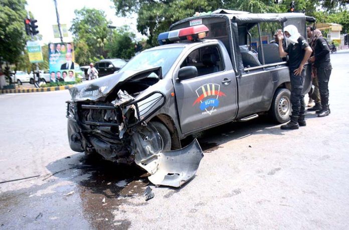 A police mobile van after an accident on Mall Road resulted two personnel seriously injured