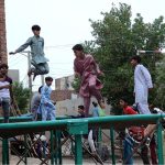 Children enjoys on jumping jack at road side setup