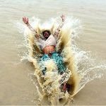 Youngsters jumping and bathing in Rice Canal to get relief from scorching hot weather