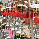 A vendor arranging and displaying the Muharram related stuff during the 08th of Muharram ul Harram