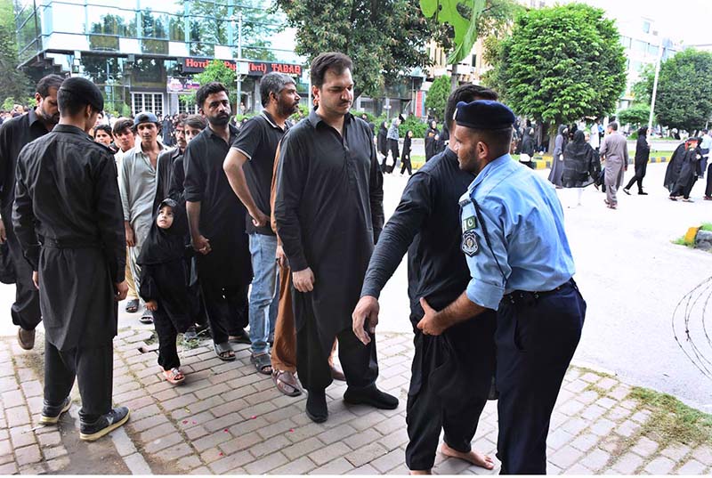 Security personnel checks people at the entrance point to attend the main procession of 9th Muharram-ul-Haram observing Youm-e-Ashura at G-6 Road. Muharram ul Harram, the first month of the Islamic calendar is known as the mourning month to pay homage in remembrance of the martyrdom (Shahadat) of Hazrat Imam Hussain (AS), the grandson of the Holy Prophet Mohammad (SAWW), along with his family members and companions at the battle of Karbala