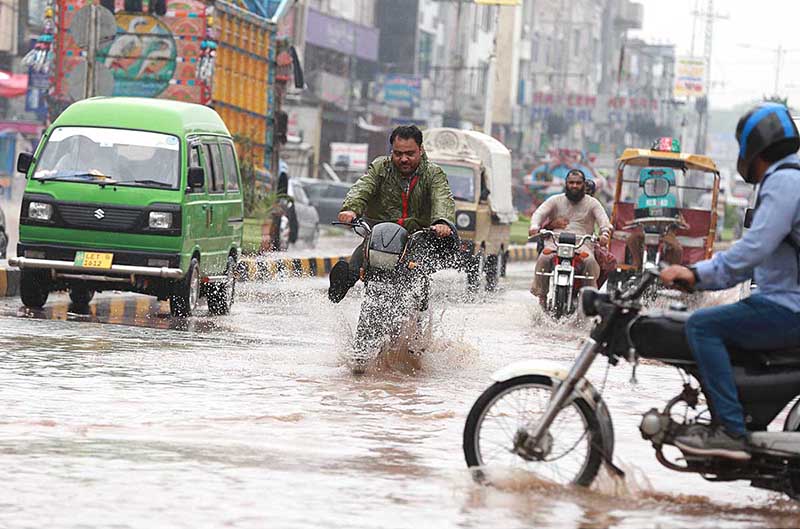 A view of rain water accumulated on the roads after rainfall causing difficulties for the commuters