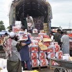People purchasing fruits at Fruit and Vegetables Market