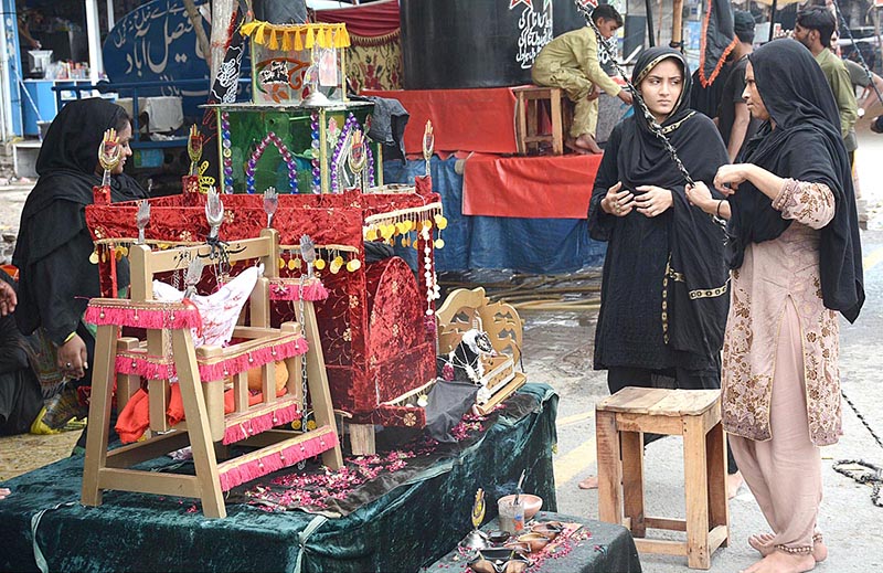 Vendors displaying the Muhrram related stuff to attract the customer at Dhobi Ghat