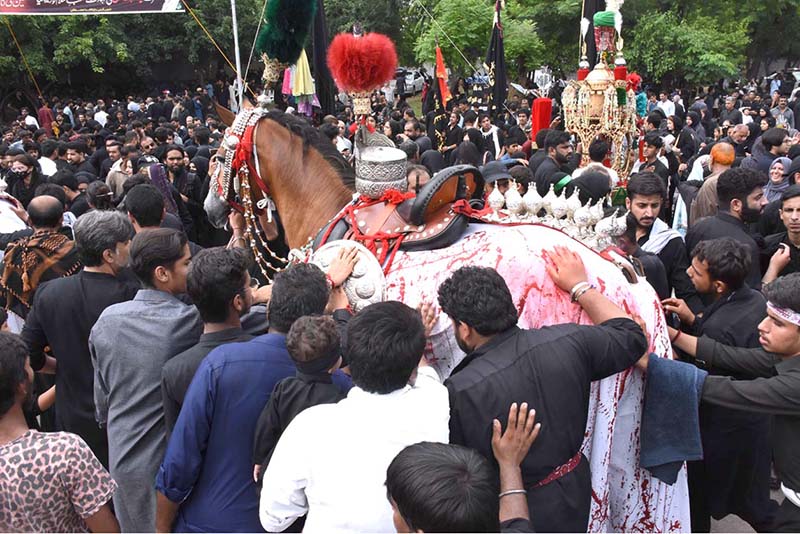 A large number of people attending the main procession of 9th Muharram-ul-Haram observing Youm-e-Ashura at G-6 Road. Muharram ul Harram, the first month of the Islamic calendar is known as the mourning month to pay homage in remembrance of the martyrdom (Shahadat) of Hazrat Imam Hussain (AS), the grandson of the Holy Prophet Mohammad (SAWW), along with his family members and companions at the battle of Karbala