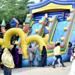 Children enjoying slide on the second day of Eid ul Adha celebrations at Minar e Pakistan