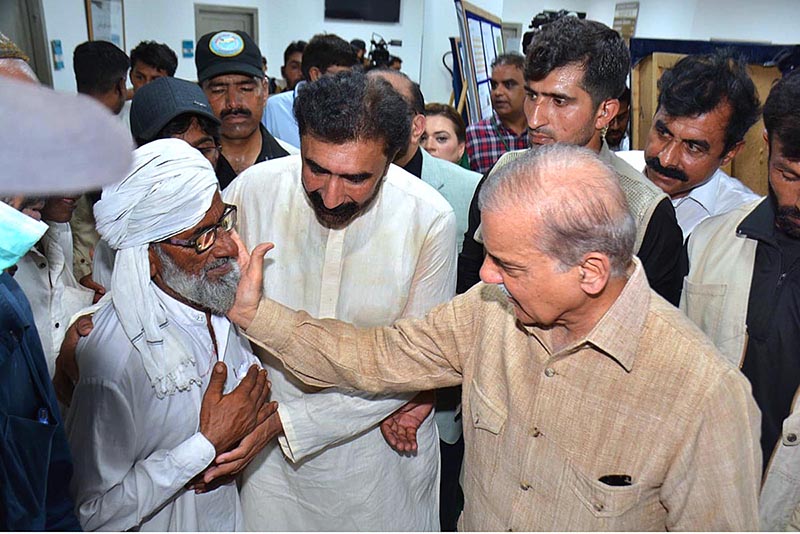 Prime Minister Muhammad Shehbaz Sharif interacts with patients during his visit to Nistar II Hospital