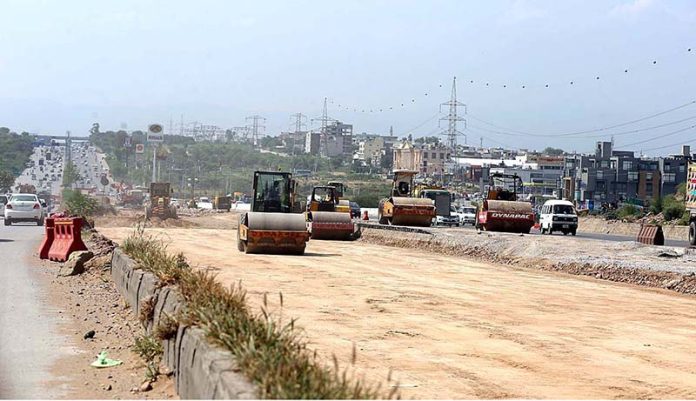 Heavy machinery being used at construction work of Expressway during development work in Federal Capital