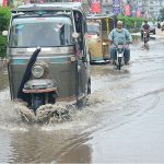 Rain water accumulated on the road at Latifabad