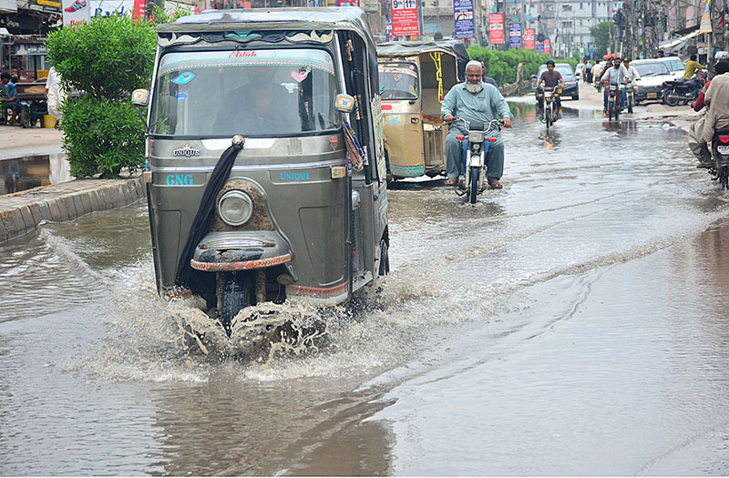 Rain water accumulated on the road at Latifabad