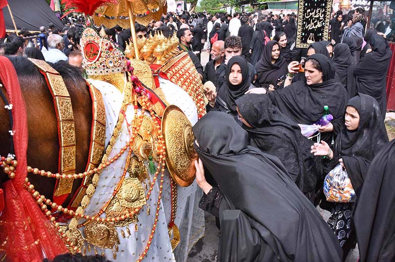 A large number of people attending the main procession of 9th Muharram-ul-Haram observing Youm-e-Ashura at G-6 Road. Muharram ul Harram, the first month of the Islamic calendar is known as the mourning month to pay homage in remembrance of the martyrdom (Shahadat) of Hazrat Imam Hussain (AS), the grandson of the Holy Prophet Mohammad (SAWW), along with his family members and companions at the battle of Karbala