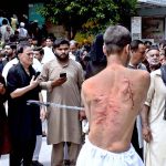 Shiite Muslims flagellate themselves with knifes on chains during the 10th Muharram procession to mark Ashoura. Ashoura is the commemoration marking the Shahadat (death) of Hussein(AS), the grandson of the Prophet Muhammad(PBUH), with his family members during the battle of Karbala for the upright of Islam