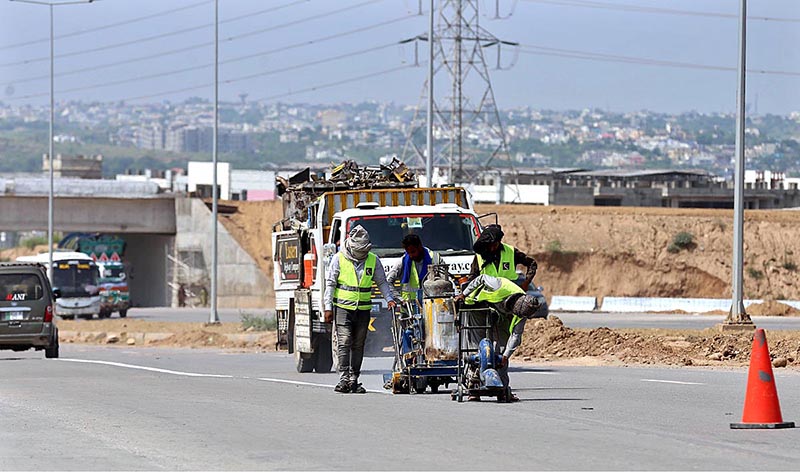 Heavy machinery being used at construction work of Expressway during development work in Federal Capital