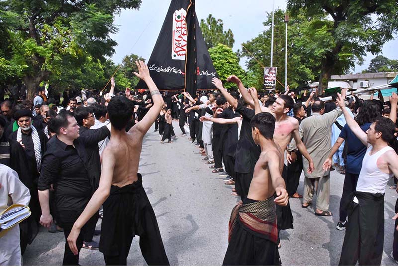 A large number of people attending the main procession of 9th Muharram-ul-Haram observing Youm-e-Ashura at G-6 Road. Muharram ul Harram, the first month of the Islamic calendar is known as the mourning month to pay homage in remembrance of the martyrdom (Shahadat) of Hazrat Imam Hussain (AS), the grandson of the Holy Prophet Mohammad (SAWW), along with his family members and companions at the battle of Karbala