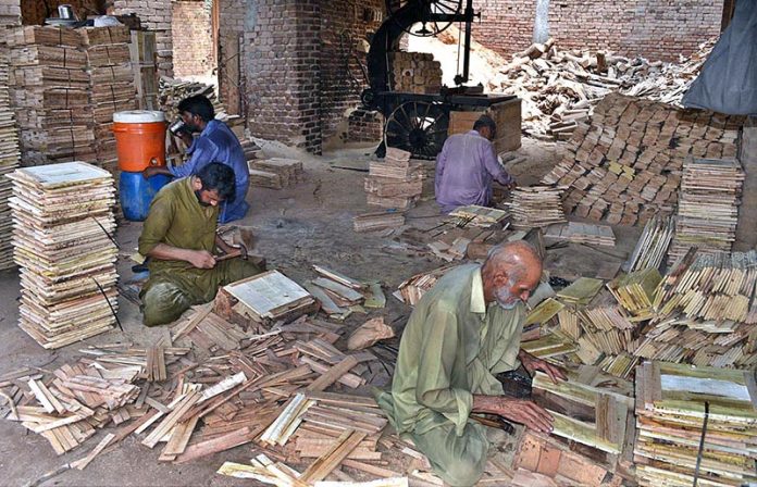 Workers are making wooden box at their work place