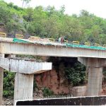 Labourers busy in their work under-construction new bridge at Swan near High Court