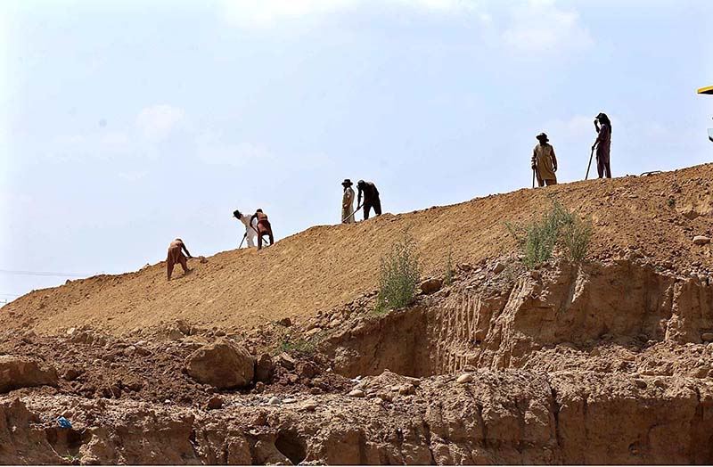 Heavy machinery being used at construction work of Expressway during development work in Federal Capital