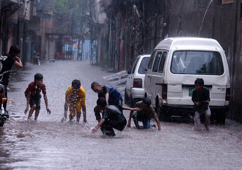 Vehicles crossing flooded water after heavy rain that experience in the provincial capital