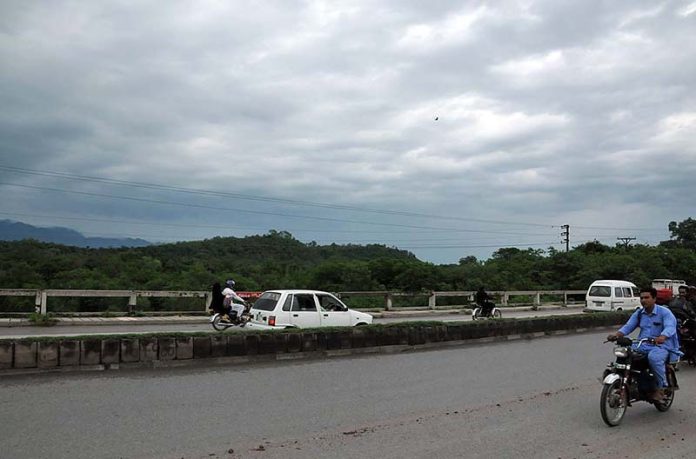 An attractive view of thick clouds hovering over the skies of the Federal Capital