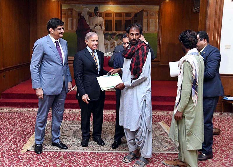 Prime Minister Muhammad Shehbaz Sharif distributing keys of newly constructed houses donated by HBL among the Flood affectees of Sindh