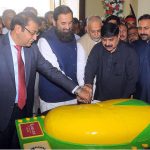 Governor Punjab Engr. Muhammad Baligh Ur Rehman cutting mango cake during the inaugural ceremony of three days ''Mango Festival 2023'' at DHA Arena Hall