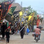 Shopkeepers displays Muharram ul Haram processions-related stuff to attract the customers near Ali Chowk